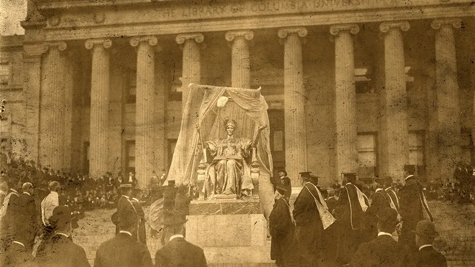 1903 photo of Alma Mater statue unveiling ceremony with dozens of attendees in front of Low Library at Columbia University. 