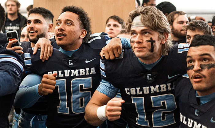 Columbia Lions watch for the results of the Harvard-Yale game. 