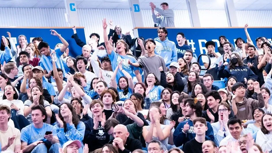 A sea of fans cheering in the bleachers of Levien Gym at the watch party for Columbia Women's Basketball vs Vanderbilt in the NCAA Tournament