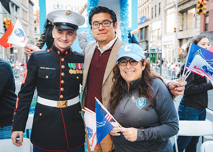 Columbia General Studies Dean Lisa Rosen-Metsch on Columbia's Veterans Day parade float with student veterans