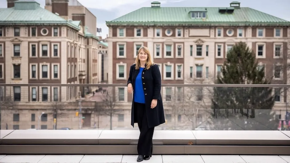 Barnard President Laura Ann Rosenbury standing on Barnard's campus with Columbia University in the background.