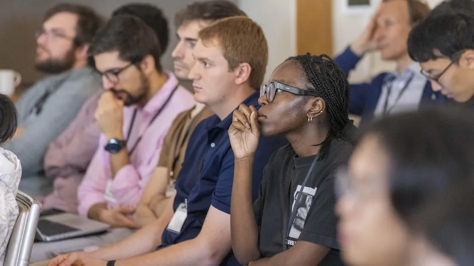 Students listening to presentation at a meeting for quantum materials at Columbia University