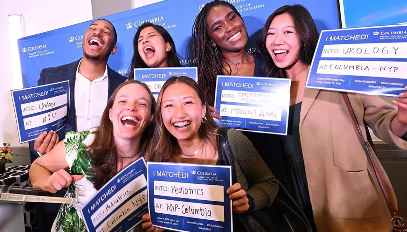 CUIMC match day students with signs