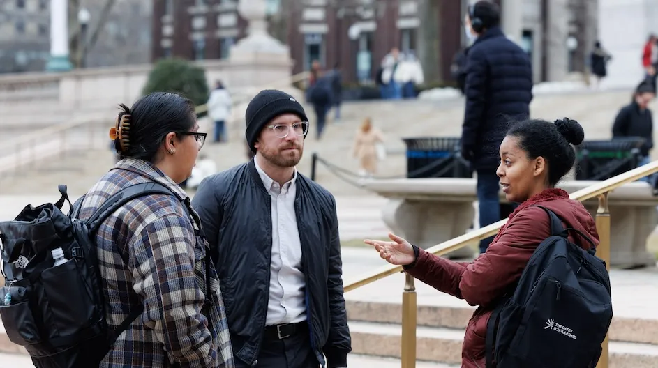Members of the Columbia community talking on College Walk on Morningside campus