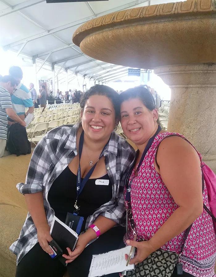 Mia and her mom pose for a photo after Convocation in 2016. 