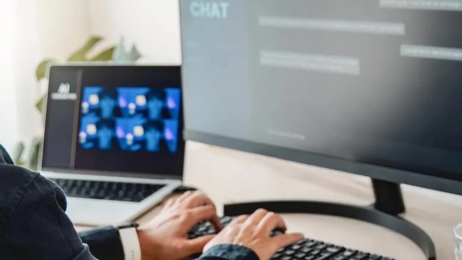 A person typing on a computer.