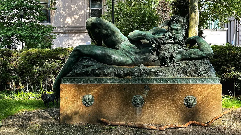 A sculpture of the Great God Pan and a French bulldog at Columbia University.