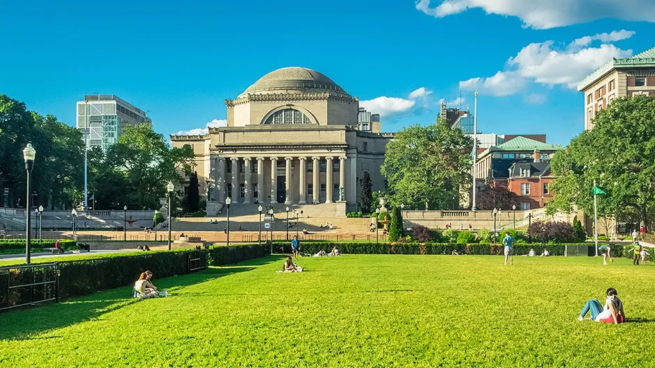 A sunny view across South Lawn to Low Library and a vivid blue sky on Columbia's Morningside campus.