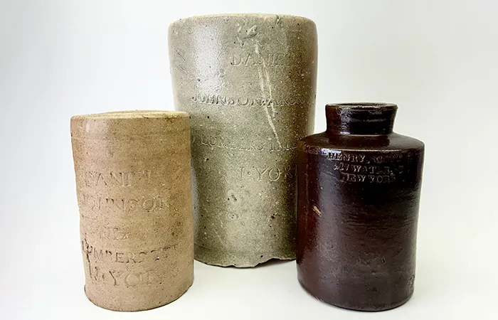 Left to right: Thomas W. Commeraw (ca. 1772–1823). Oyster jar marked “Daniel Johnson and Co.,” 1799–1804. Ceramic with salt glaze. Thomas W. Commeraw (ca. 1772–1823). Oyster jar marked “Daniel Johnson and Co.,” 1799–1804. Ceramic with salt glaze. Oyster jar marked “Henry Scott,” 1820–40. Ceramic with Albany slip glaze. Collection of Chris Pickerell.