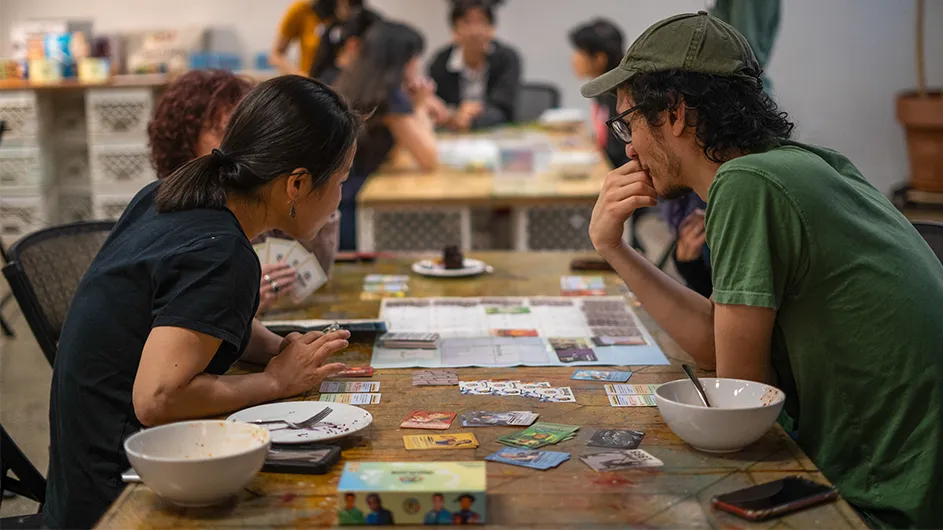 Game night attendees play Trailblazer Heroes.