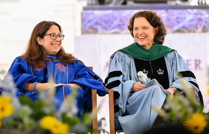 Columbia General Studies Dean Lisa Rosen-Metsch and Interim President Katrina Armstrong prepare to greet students at Columbia General Studies Convocation. 