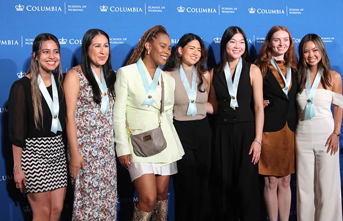 Columbia Nursing students gather for a pinning ceremony. 