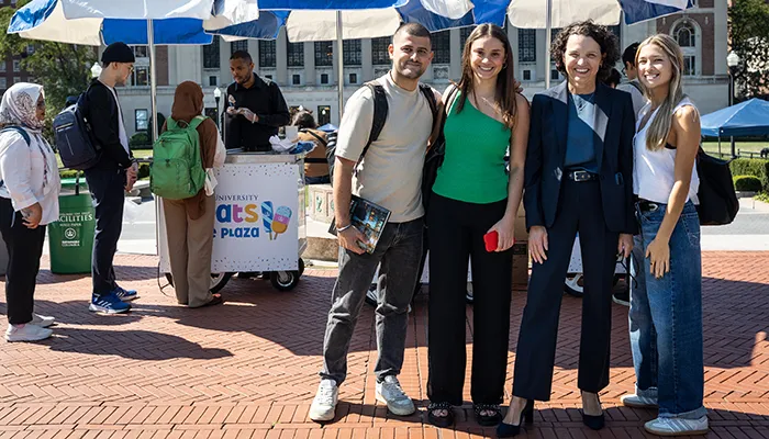Katrina Armstrong poses with students at "Treats ont he Plaza"