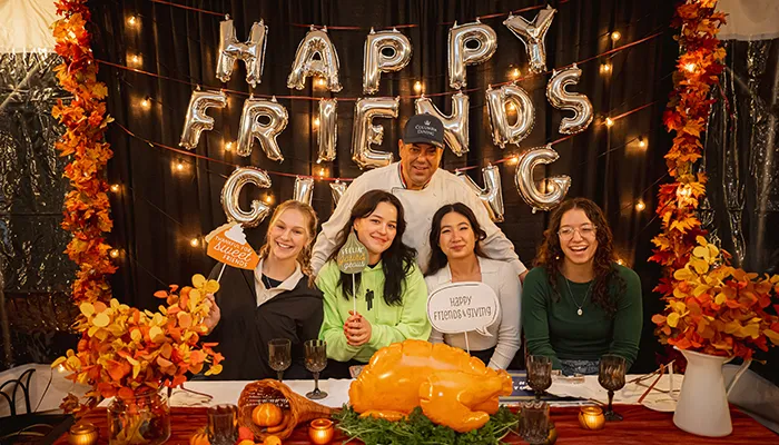 Friendsgiving Columbia Dining pose at photo booth