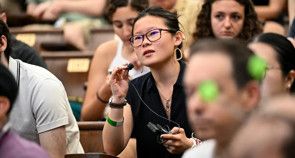 An attendee asks a question during the Q&A session.