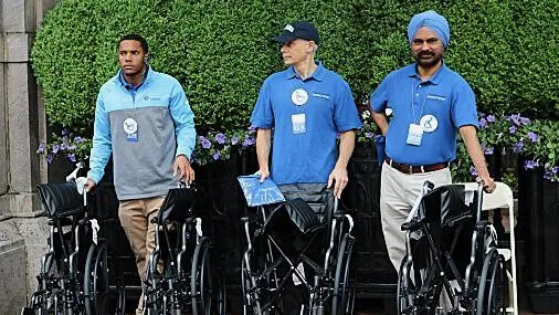 Columbia staff with wheelchairs for graduation attendees