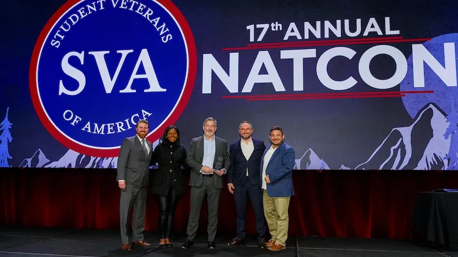Representatives of Columbia pictured on stage at an event sponsored by Student Veterans of America where the University's Center for Veteran Transition and Integration is honored with the William Pearson Tolley Champion for Veterans in Higher Education Award.