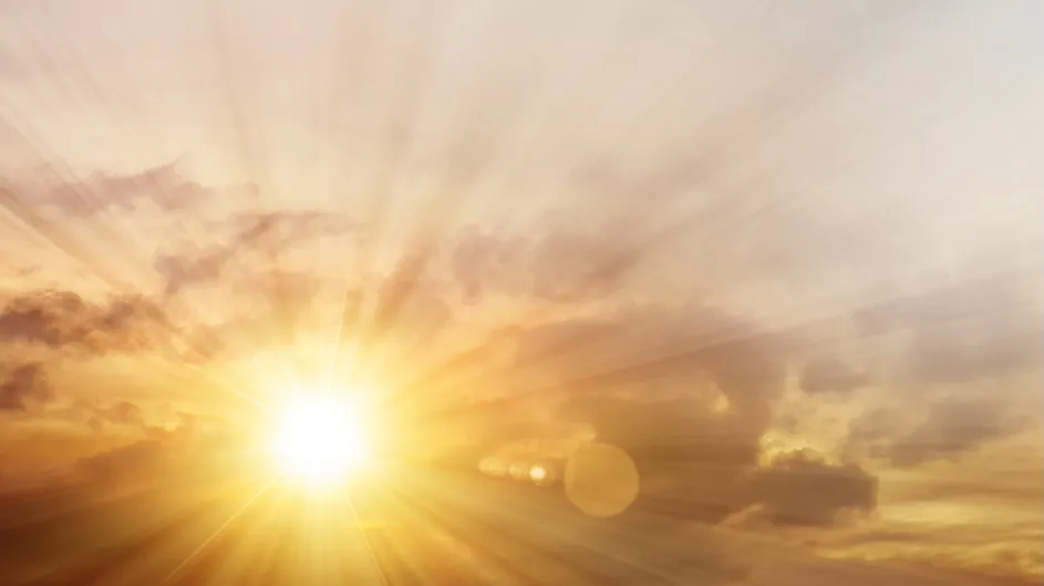 The sun peeking through clouds.