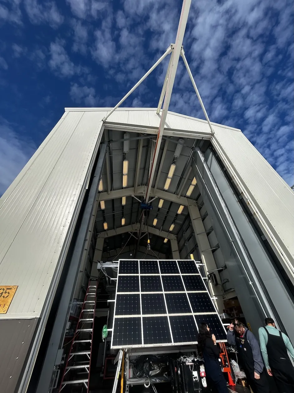 The team opened the door of a high-bay at McMurdo station to test the experiment's solar panels.
