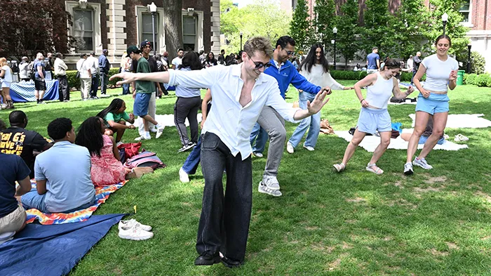 Students dancing on a Columbia quad.