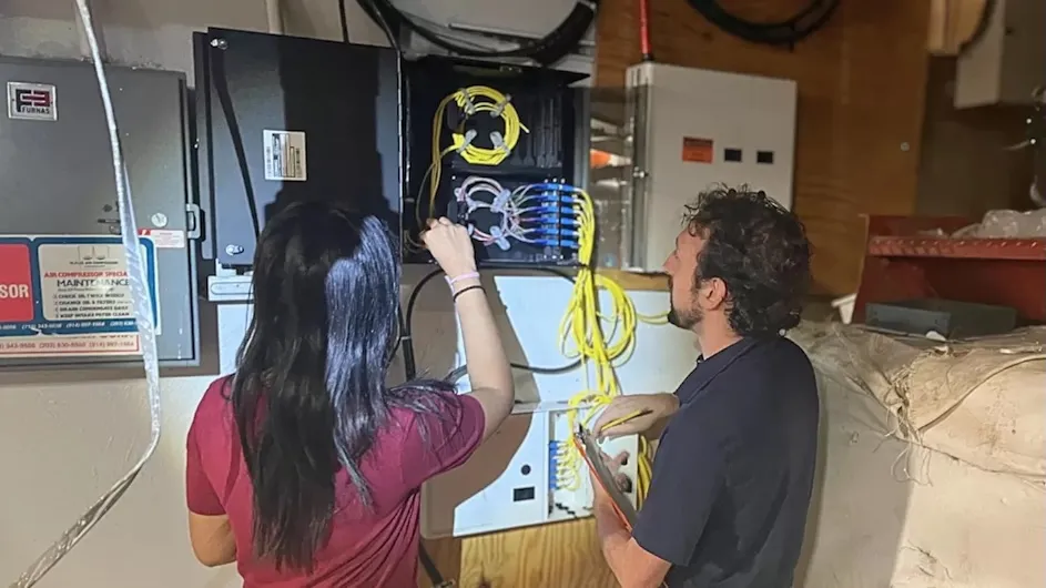 Shivalee Shah, MS student in Quantum Science and Technology, and John Drogo, Electrical Engineering PhD student, worked with CUIT and Crown Castle on the fiber connection to Brooklyn.