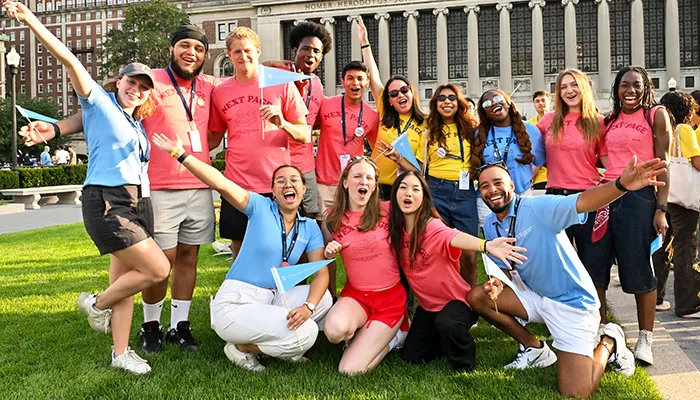 A group of NSOP leaders cheers for new students on Butler Lawn.