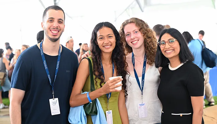 Four general studies students pose at Convocation.