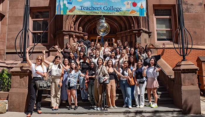 Teachers College students pose on the steps of Zankel Hall