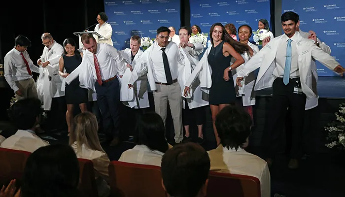 Vagelos College of Physicians and Surgeons students put on their white coats. 