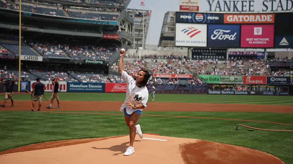 Megan Griffith throws the first pitch at Yankees stadium