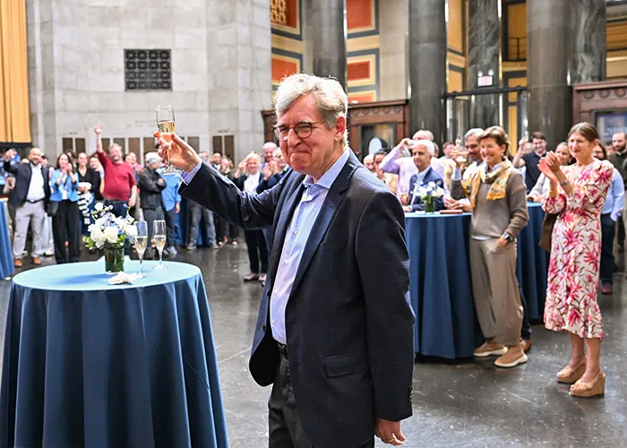Raising a glass to Michael Woodford, John Bates Clark Professor of Political Economy, recipient of the Sveriges Riksbank Prize in Economic Sciences in Memory of Alfred Nobel in the Low Library Rotunda on Oct. 12, 2026. Photo by Diane Bondareff/Columbia University.