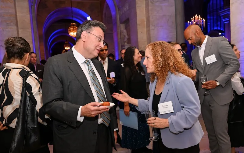 President Mnookin spent the reception in conversation with alumni. Photo by Diane Bondareff.