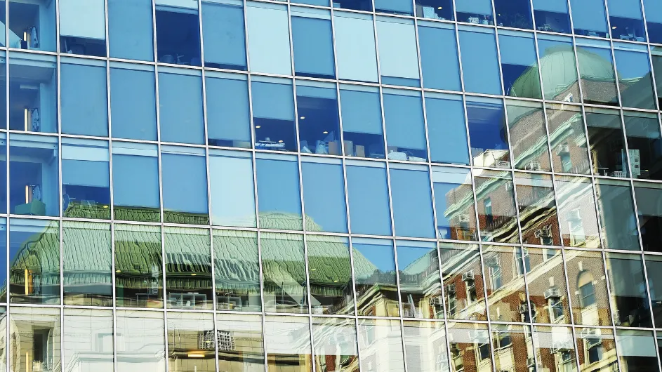 Reflection of Pupin Hall in the glass of Columbia University's Northwest Corner Building