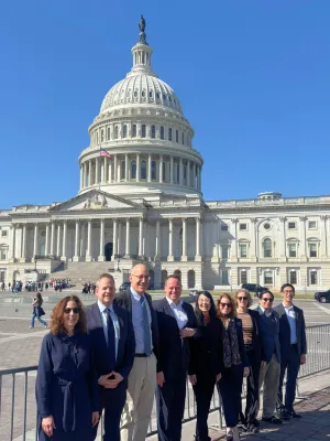 Members of the quantum panel standing in front of the U.S. Capitol Hill