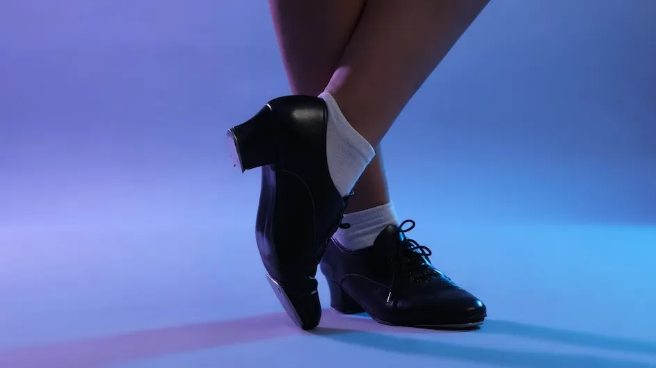 A focus on the shoes of a tap dancer 
