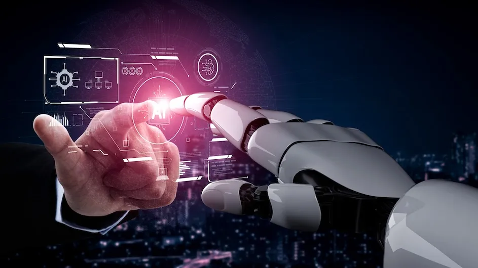 Image of a human hand touching a robotic hand through a screen on the term “AI”