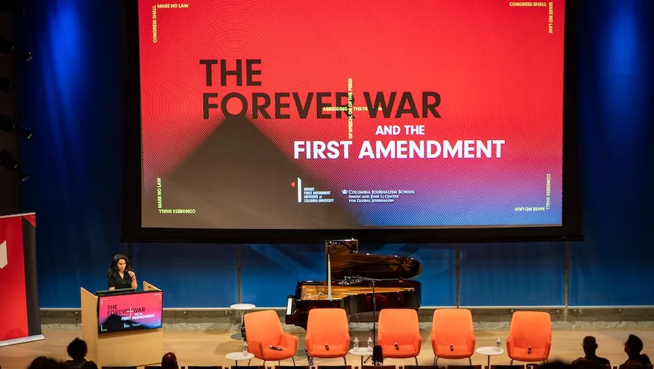 Azmat Khan, Patty Cadby Birch Assistant Professor at Columbia Journalism School, where she leads the Simon and June Li Center for Global Journalism, on stage, opening the “Forever War” symposium at Columbia University. Photo by Siobhan Mullan.