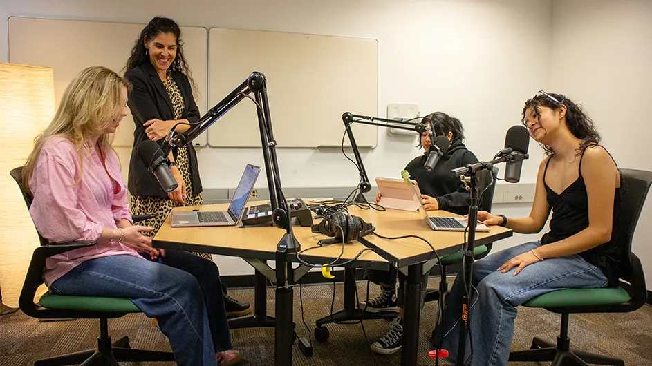 Students record a podcast in the Language Resource Center Media Room.  