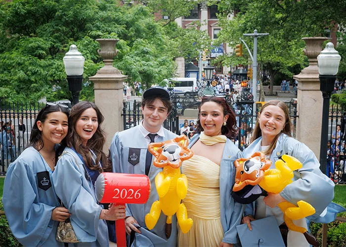 Grads pose at the gates