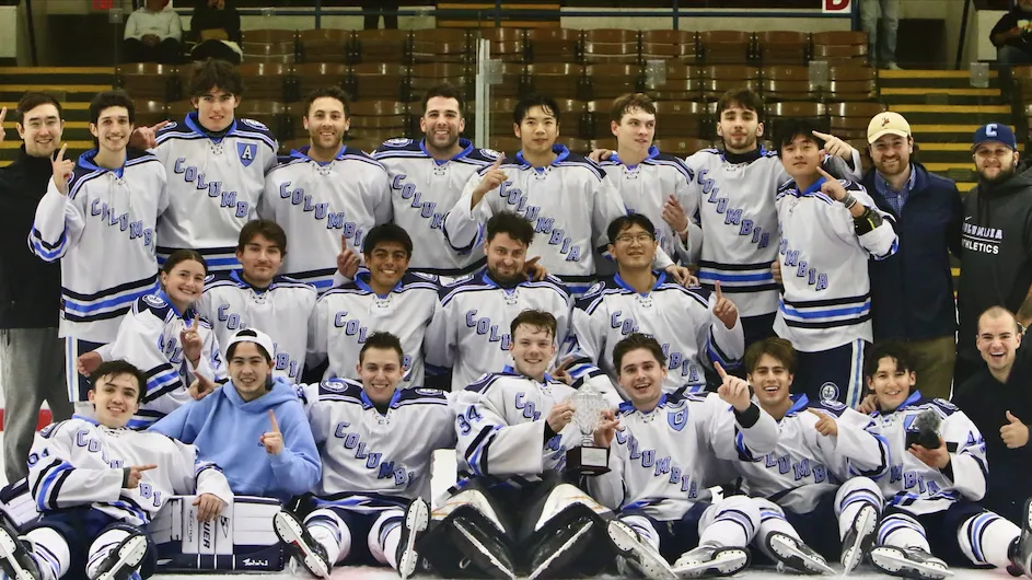 Columbia University ice hockey club lined up for a team photo in their uniforms