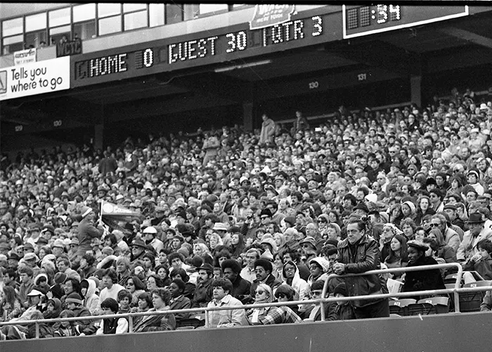 A crowd at a football game in 1976.
