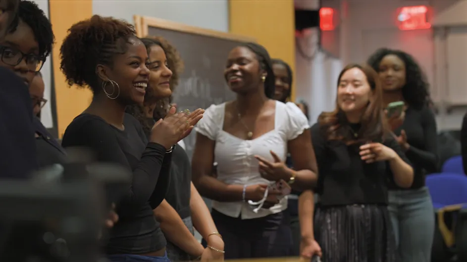 Members of the Columbia Gospel Choir singing and having fun during a choir meeting. 
