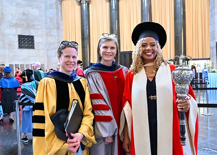 Executive Vice President of the Arts and Science Amy Hungerford, Provost Angela Olinto, and ceremonial mace bearer and Associate Professor of Climate Kristina Douglass prepare to enter the afternoon Commencement ceremony. 
