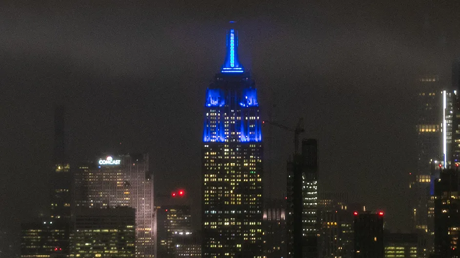 The Empire State Building, illuminated blue for Columbia graduates. Photo by David Dini/Columbia University. The Empire State Building image® is a registered trademark of ESRT Empire State Building, L.L.C. and is used with permission.