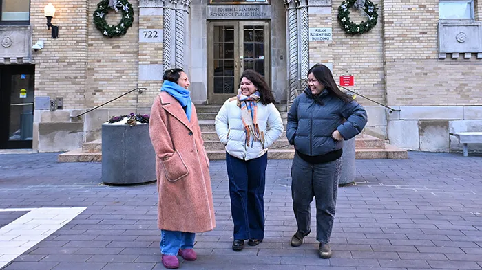 Students congregate outside of the Mailman School of Public Health