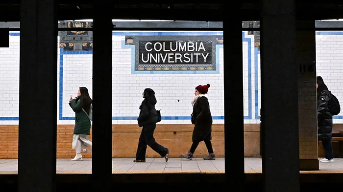 Columbians gear up for the winter chill outside inside the relatively warmer (and iconic!) 116th subway stop.
