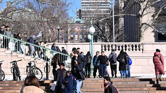 Students scurry across Morningside campus to make it to class on time in the winter chill. 