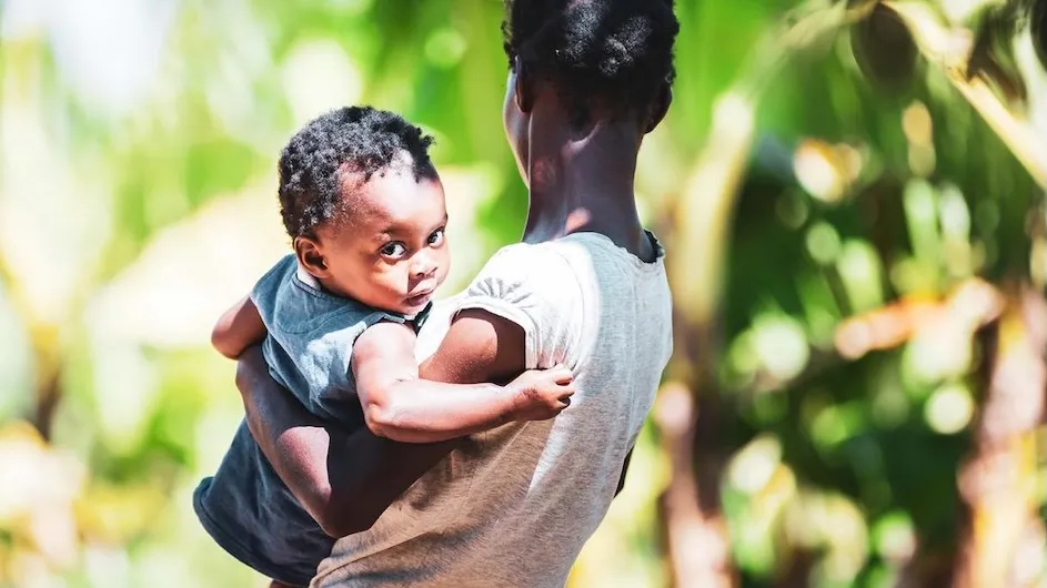 A person holding a baby
