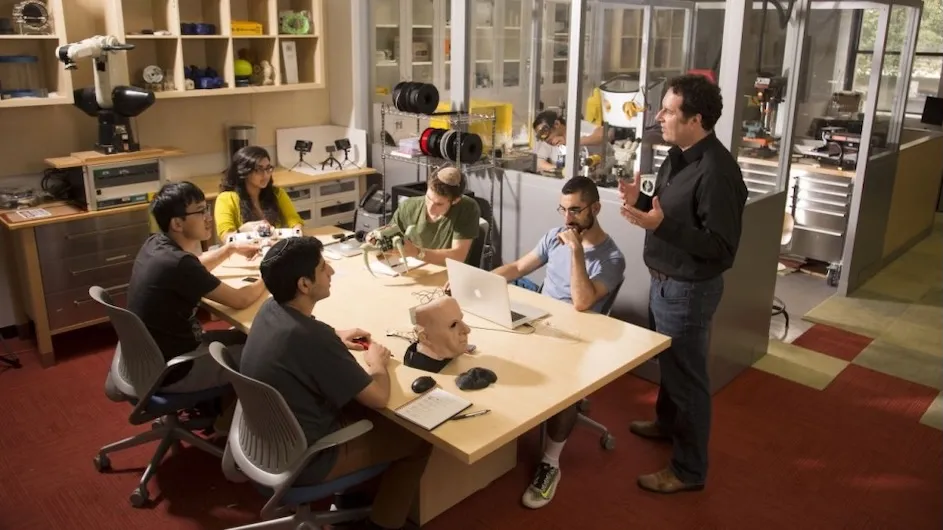 Hod Lipson (standing) is the James and Sally Scapa Professor of Innovation and chair of the Department of Mechanical Engineering at Columbia Engineering who leads the Columbia portion of the institute.