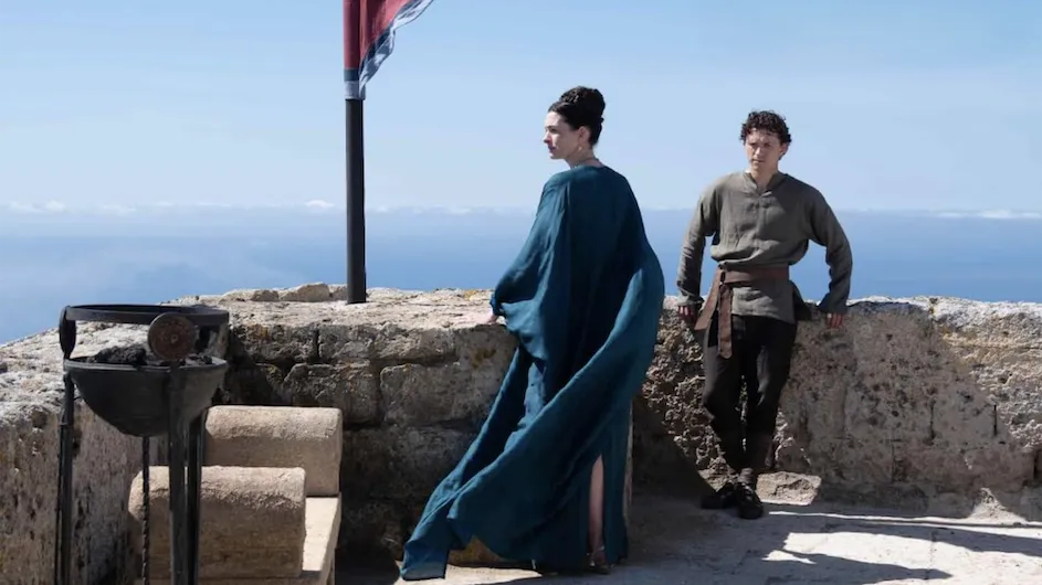 An image from the movie “The Odyssey,” showing the actress Anne Hathaway, as Penelope, and the actor, Tom Holland, as Telemachus. Universal Pictures.